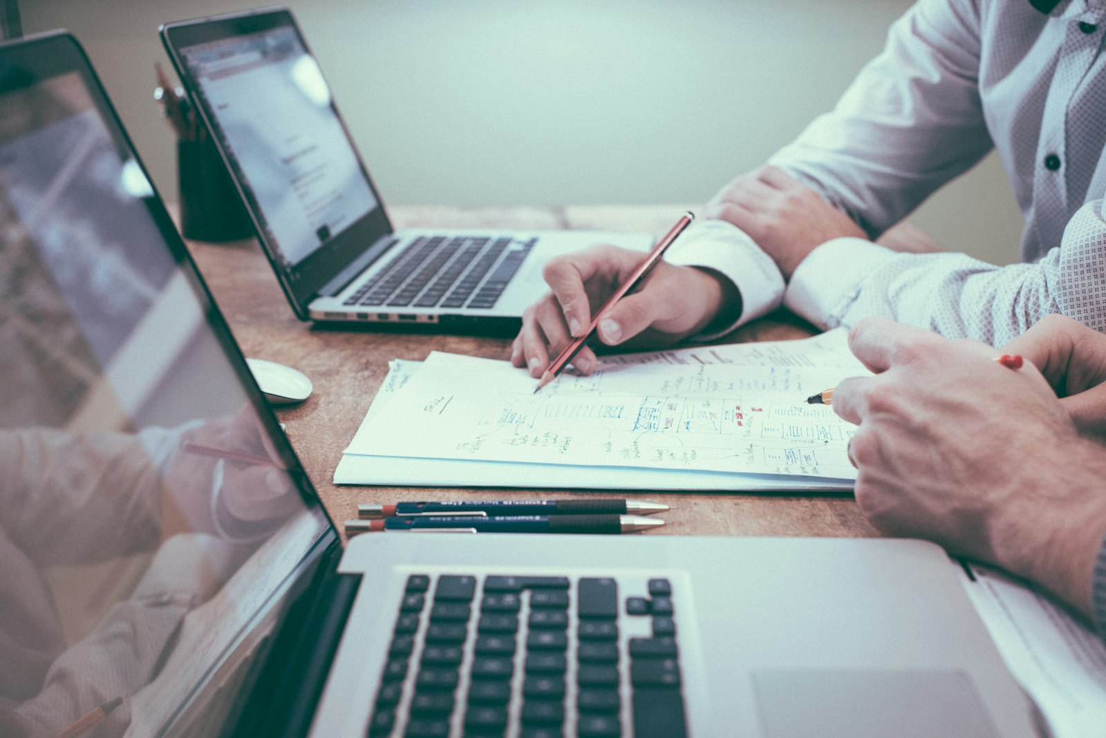 Two people planning a business workflow
